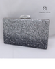 Clutch metálico en color plata y negro