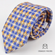 Corbata beige con estampado floral azul y dorado