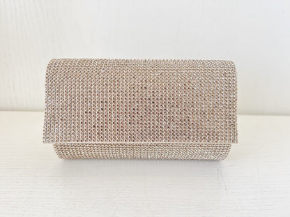 Clutch Rulo Dorado con Brillantes